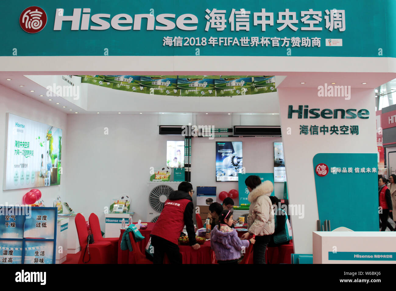 --FILE--People visit the stand of Hisense during an exhibition in Changzhou city, east China's Jiangsu province, 17 March 2018.   Electronics manufact Stock Photo