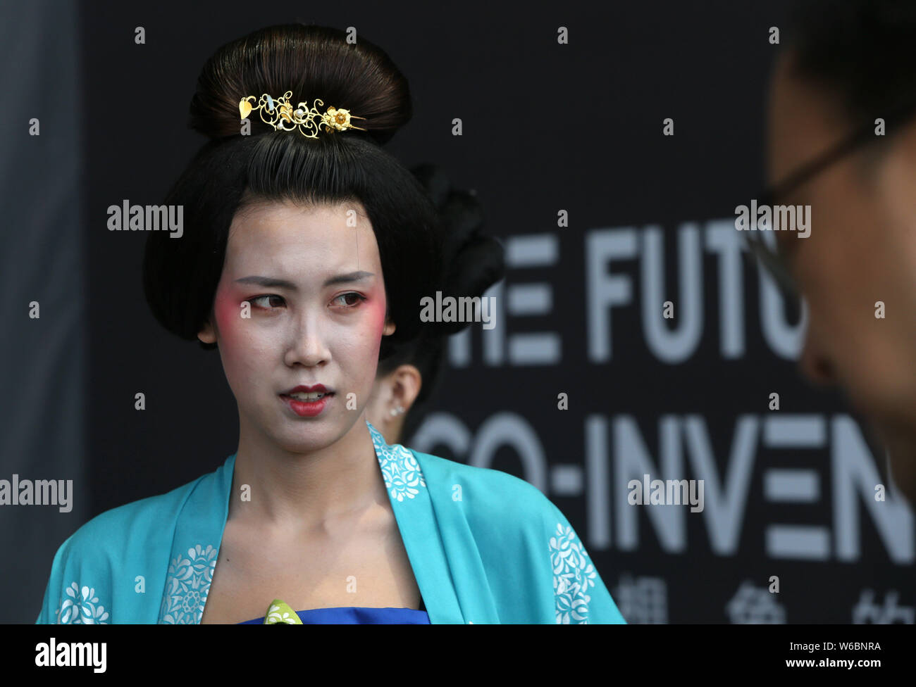 A Performer dressed in ancient Chinese costumes of Tang Dynasty (618-907) attends the World INS (Innovate, Network and Share) Conference 2018 in Xi'an Stock Photo