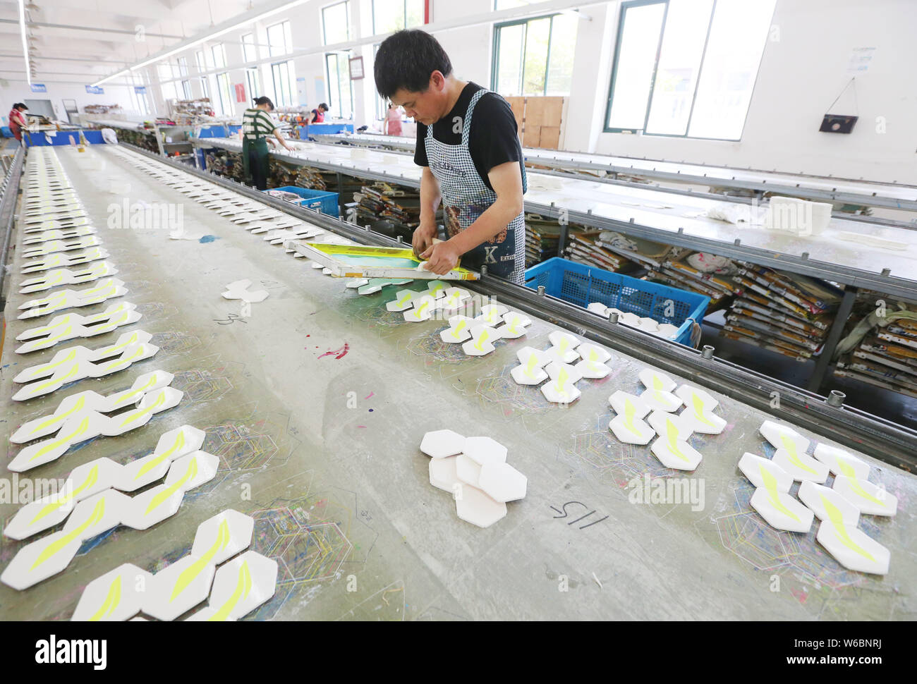 A Chinese worker manufactures footballs for the 2018 FIFA World Cup at