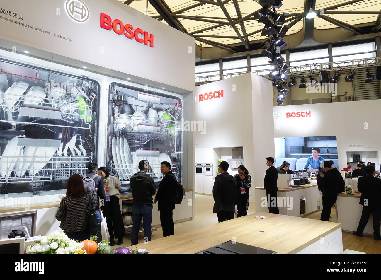 FILE--People visit the stand of Bosch during an expo in Shanghai, China, 10  March 2018. German engineering and electronics company Robert Bosch Gm  Stock Photo - Alamy