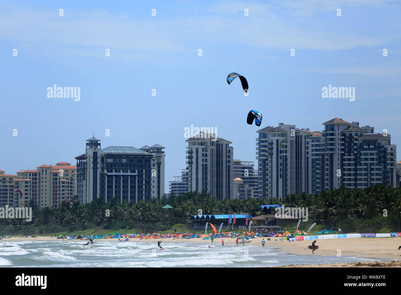 Kite surfers compete during the 2018 Boao International Kiteboarding Festival, also the qualification event of the 2018 Youth Olympic Games (YOG), in Stock Photo