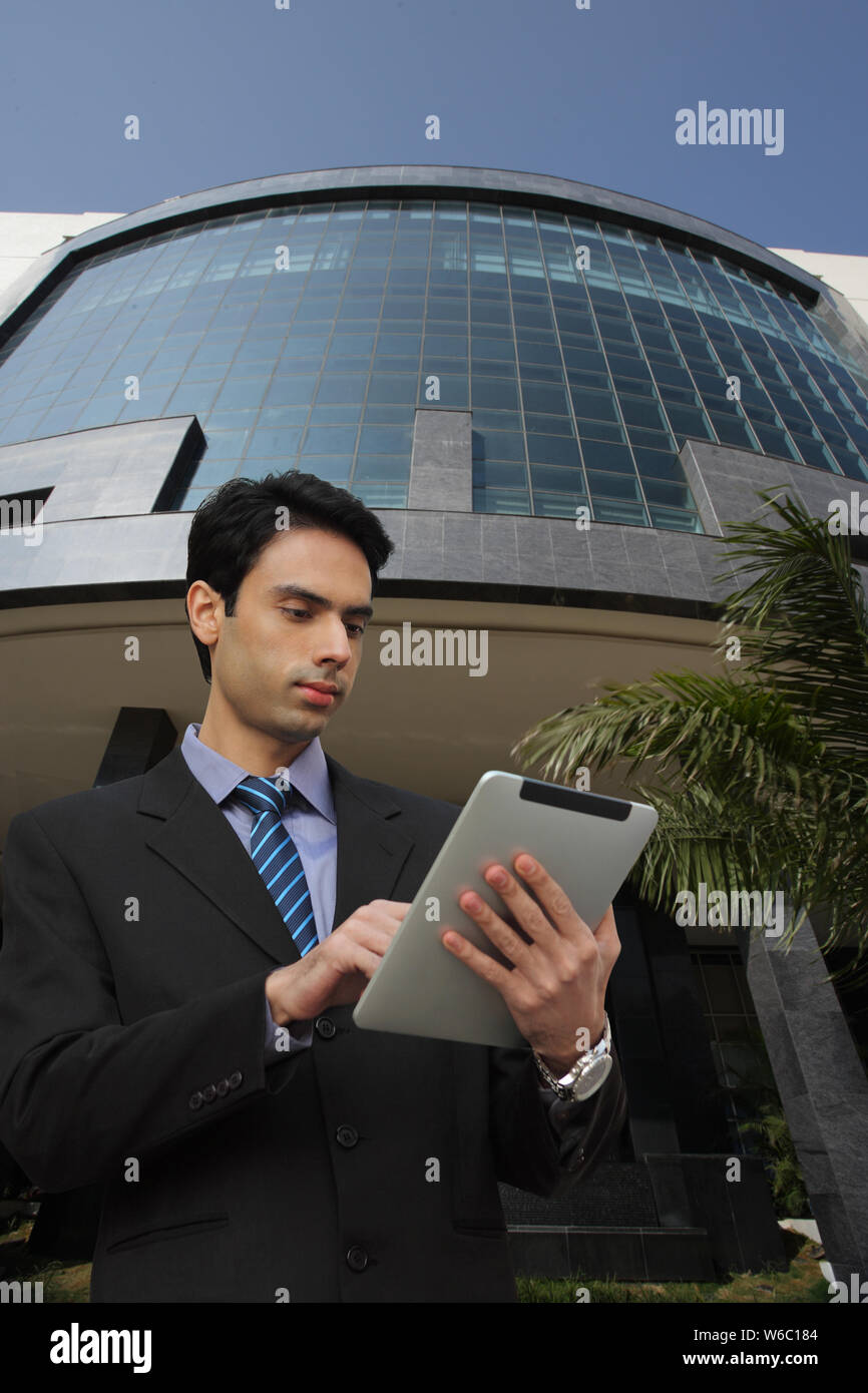 Businessman using a digital tablet Stock Photo