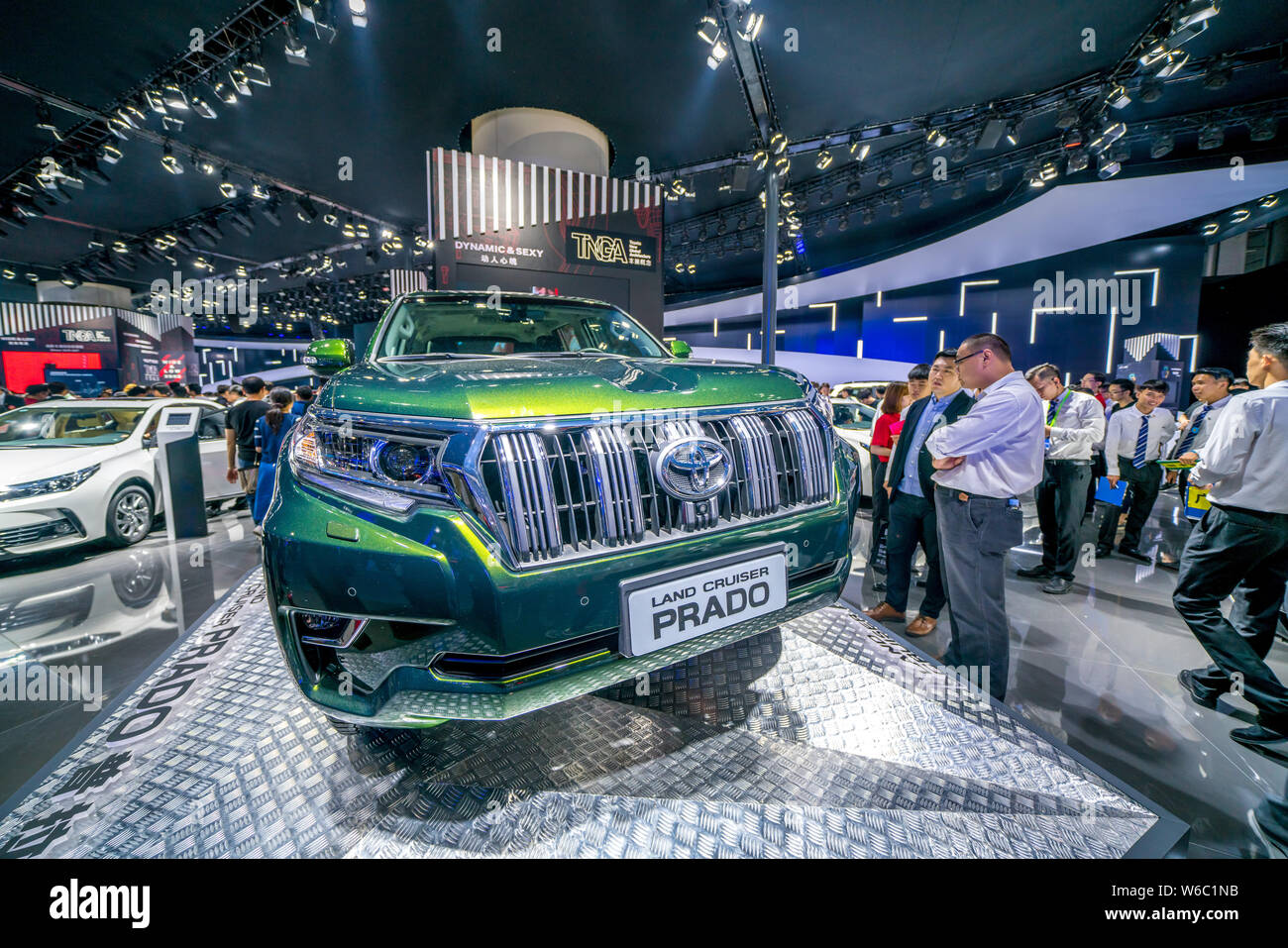 --FILE--People look at a Toyota Land Cruiser Prado at the stand of Toyota during the 15th China (Guangzhou) International Automobile Exhibition, also Stock Photo