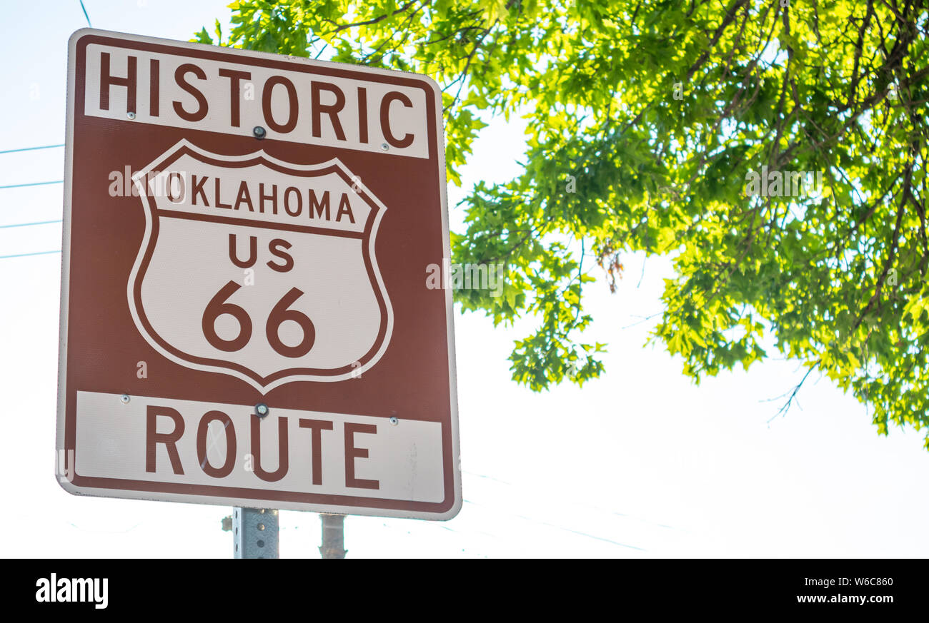 Route 66, Oklahoma. Brown color road sign at Tulsa OK, sunny day, Route 66 the classic historic roadtrip in USA Stock Photo