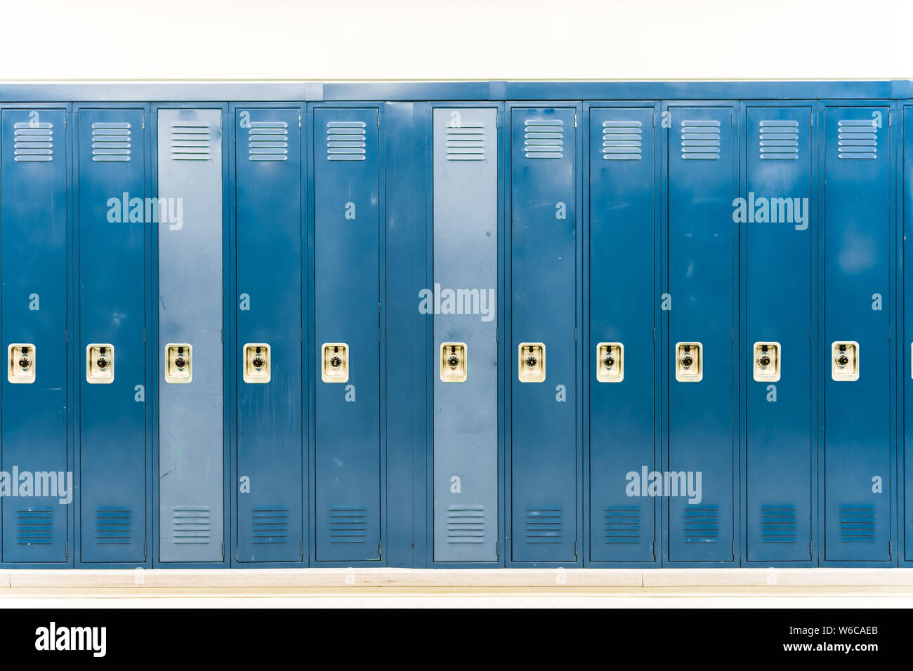 Worn down navy blue school lockers straight on Stock Photo - Alamy