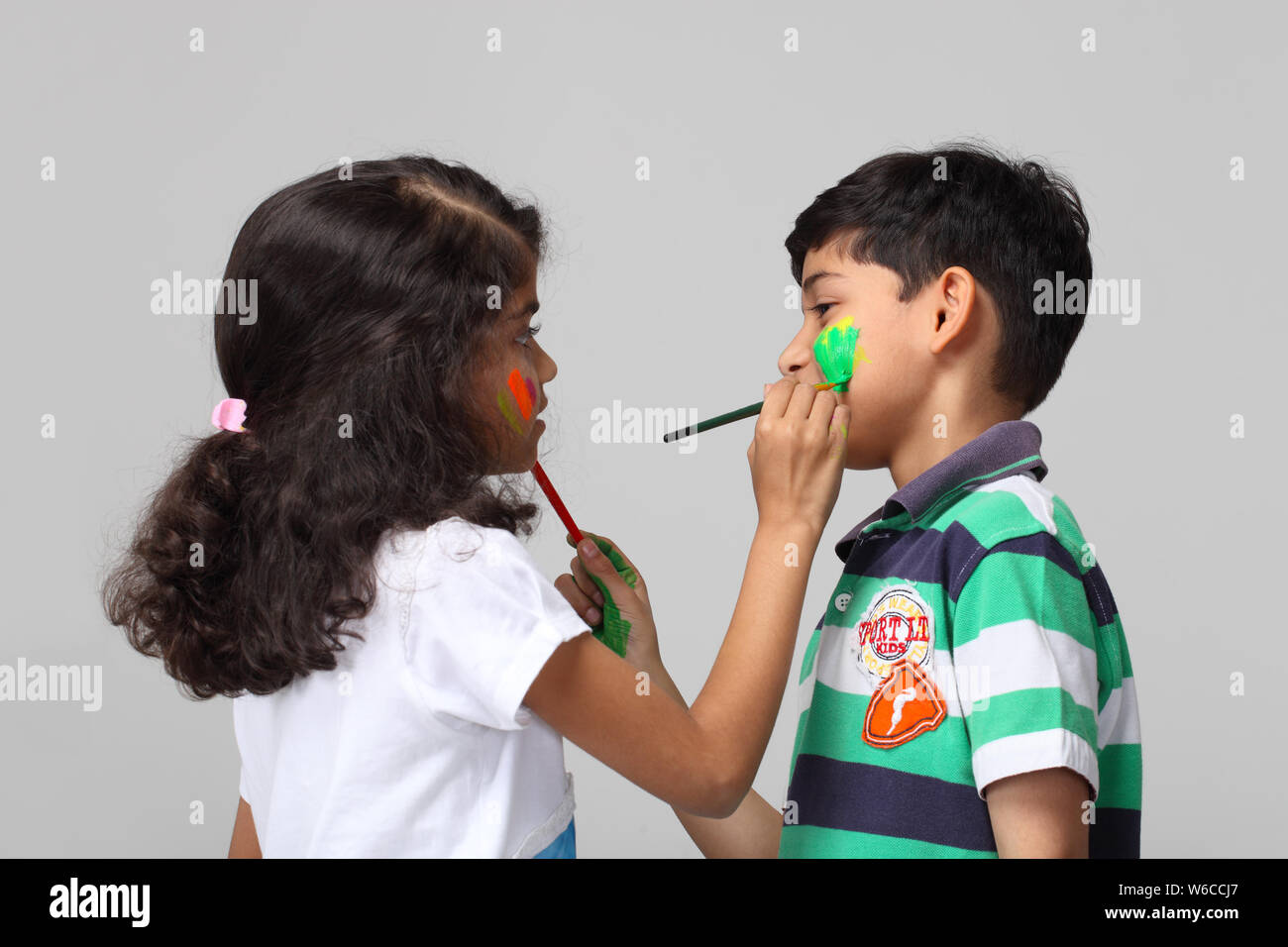 Boy cheek painting hi-res stock photography and images - Alamy