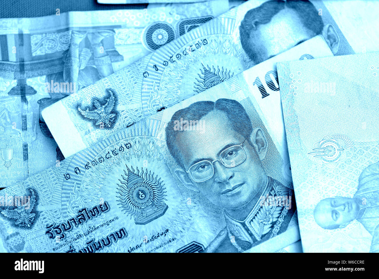 Various banknotes thai baht close up. Money background blue color toned  Stock Photo - Alamy