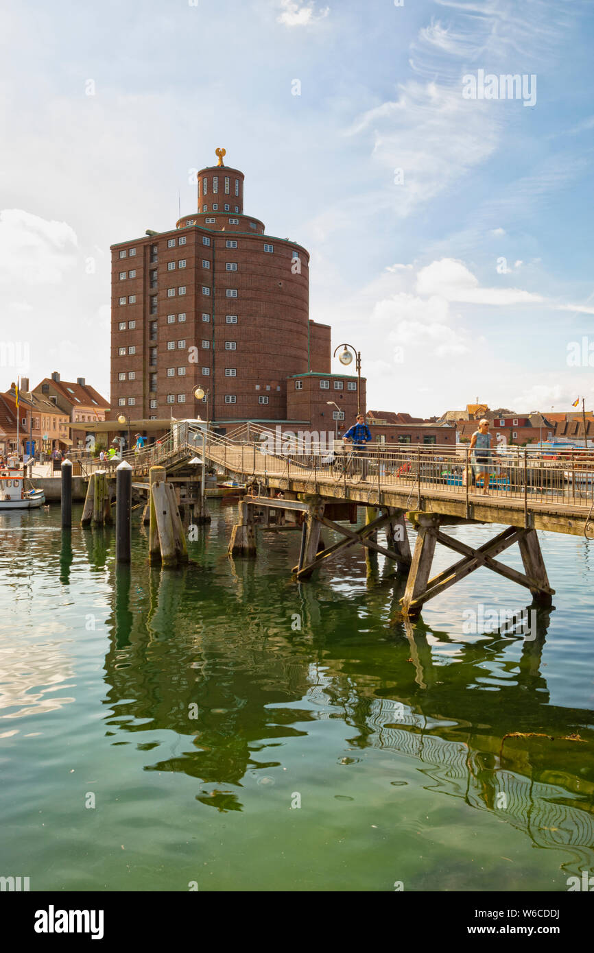 The historic warehouse known as Rundsilo and the wooden drawbridge at the harbor of Eckernförde on the Baltic Sea coast Stock Photo