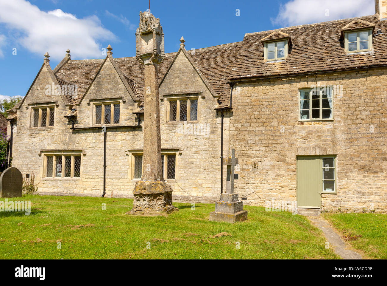 Historic Stone Cottages And 14th Century Market Cross In Saxon