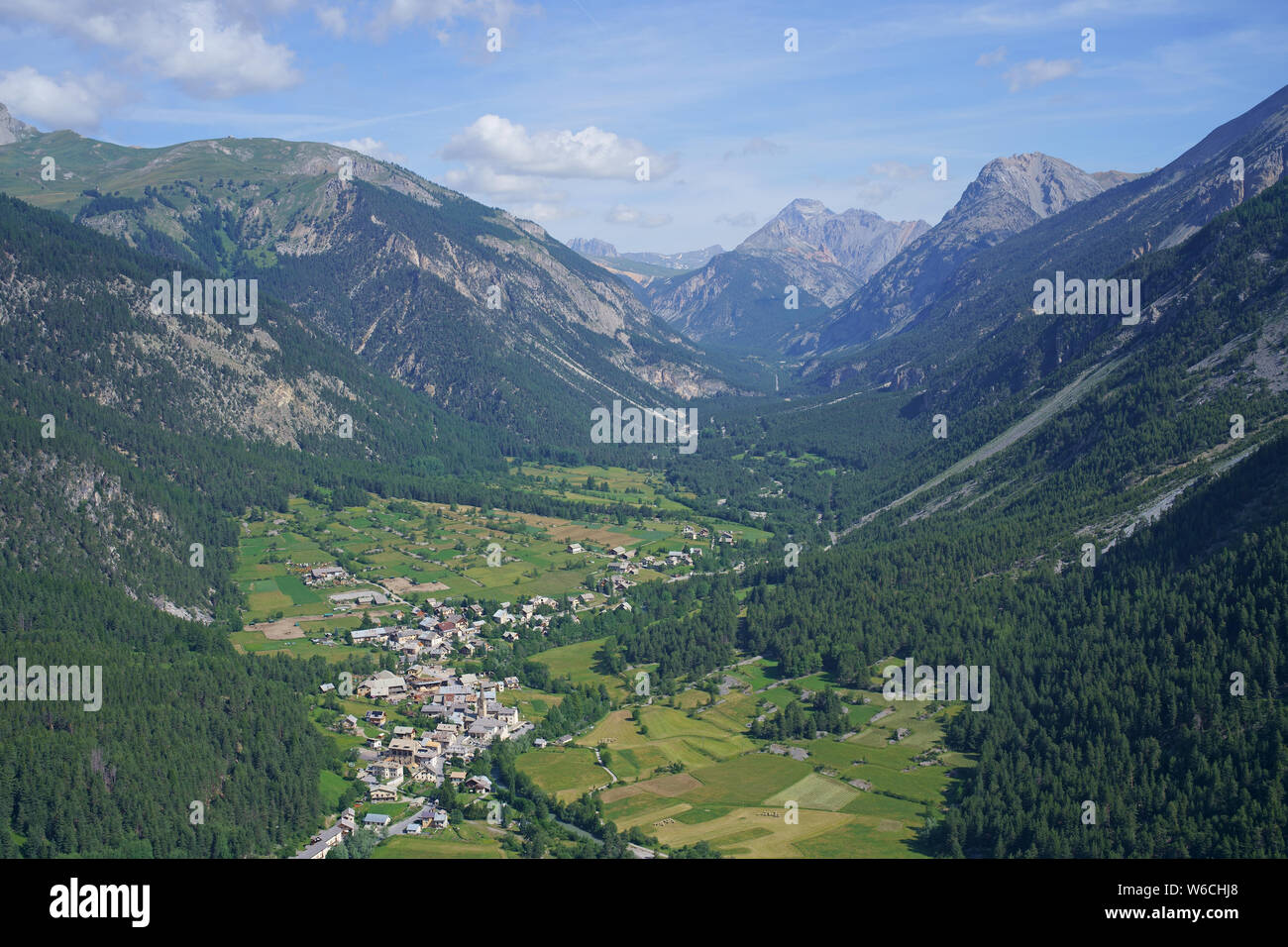AERIAL VIEW. Pristine Clarée Valley with the village of Val-des-Prés. Hautes-Alpes, France. Stock Photo