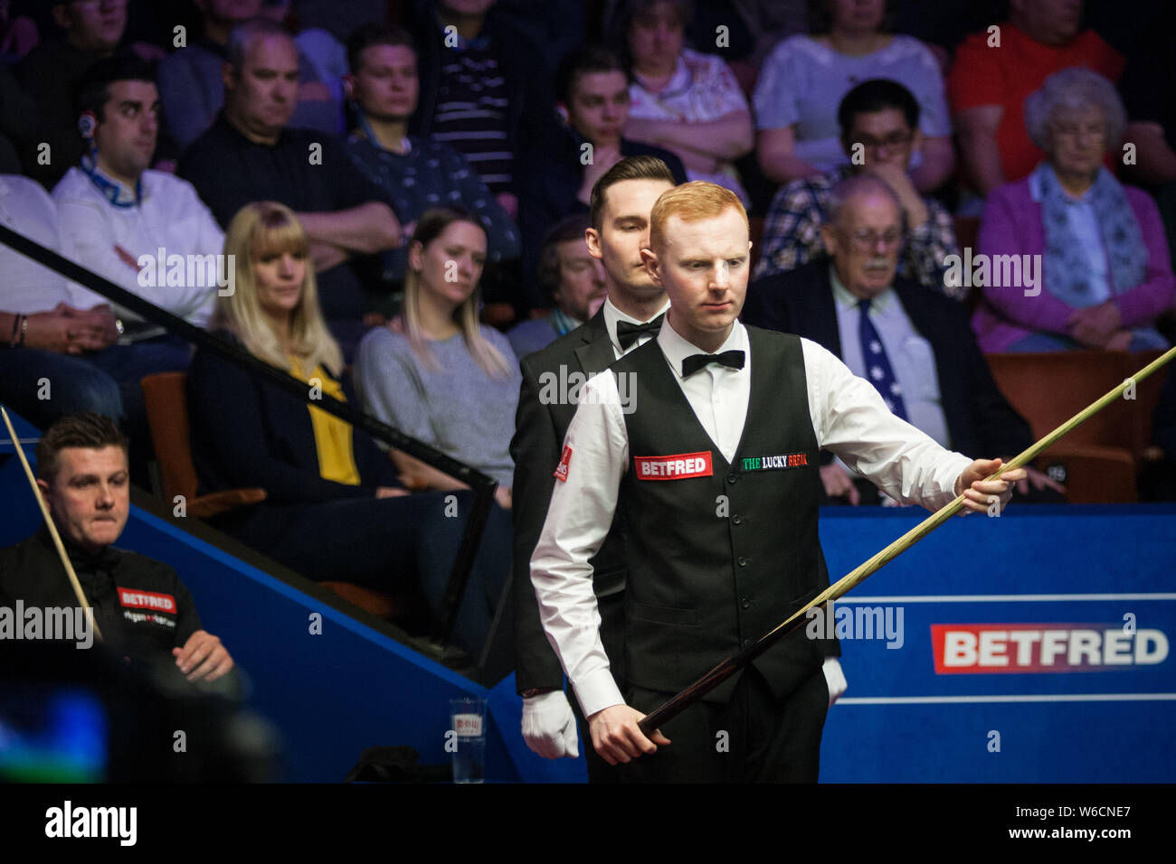 Anthony McGill of Scotland considers a shot to Ryan Day of Wales in their first round match during the 2018 Betfred World Snooker Championship at the Stock Photo