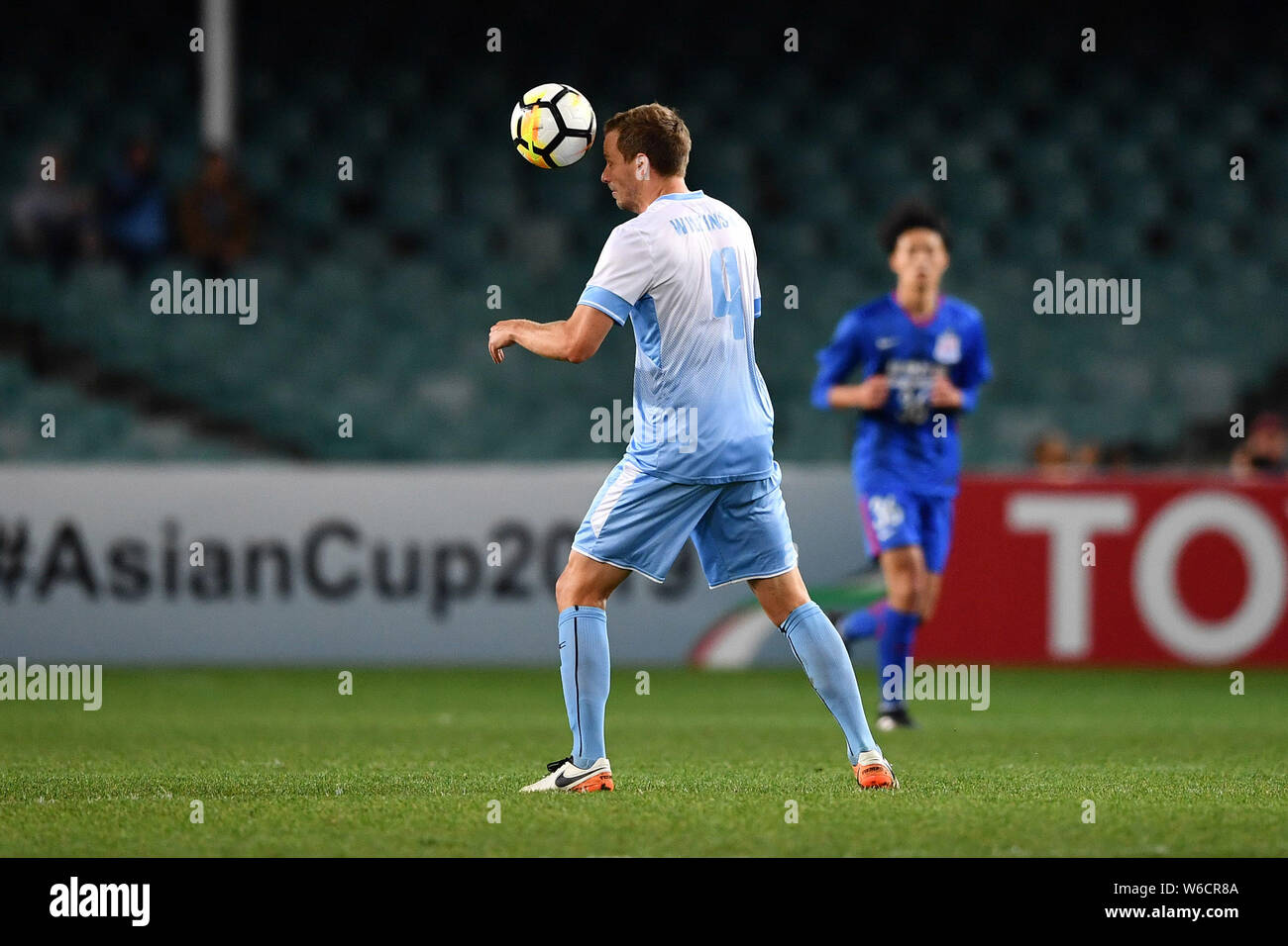 Alex Wilkinson of Australia's Sydney FC heads the ball to make a pass China's Shanghai Shenhua FC in their Group H match during the 2018 AFC Champions Stock Photo