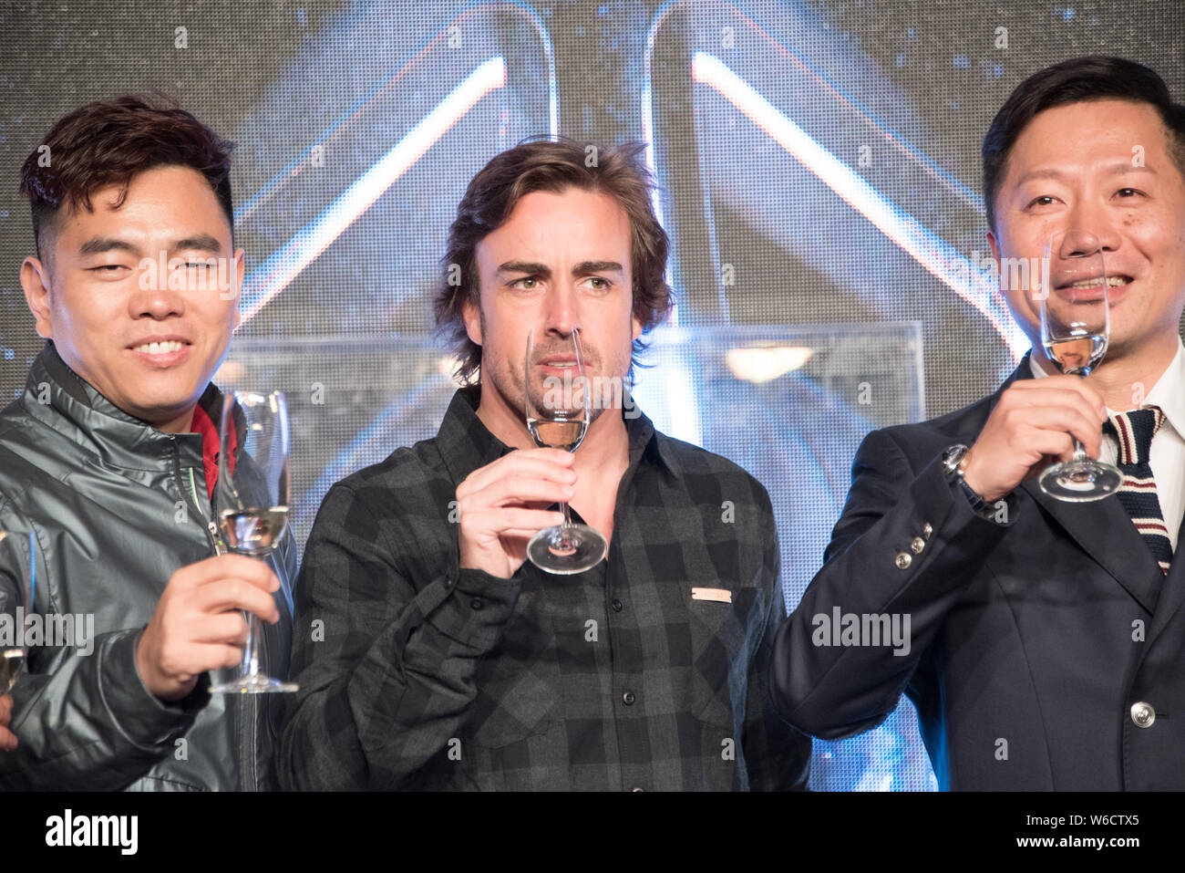 Spanish F1 driver Fernando Alonso, center, attends the press conference