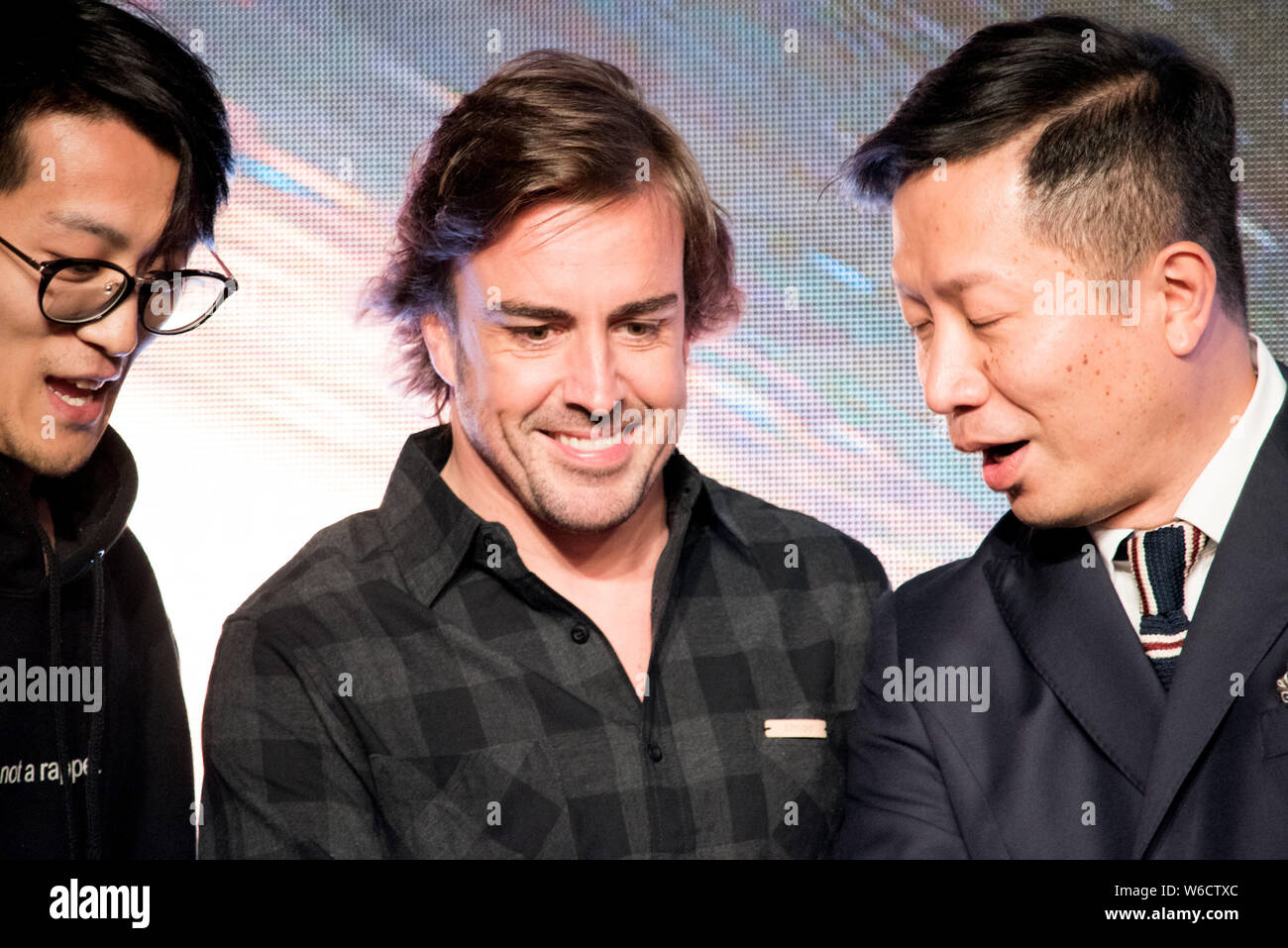 Spanish F1 driver Fernando Alonso, center, attends the press conference