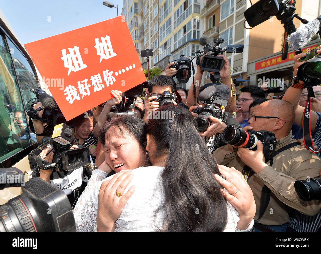 The wife of Chinese ride-sharing driver Wang Mingqing weeps as she ...