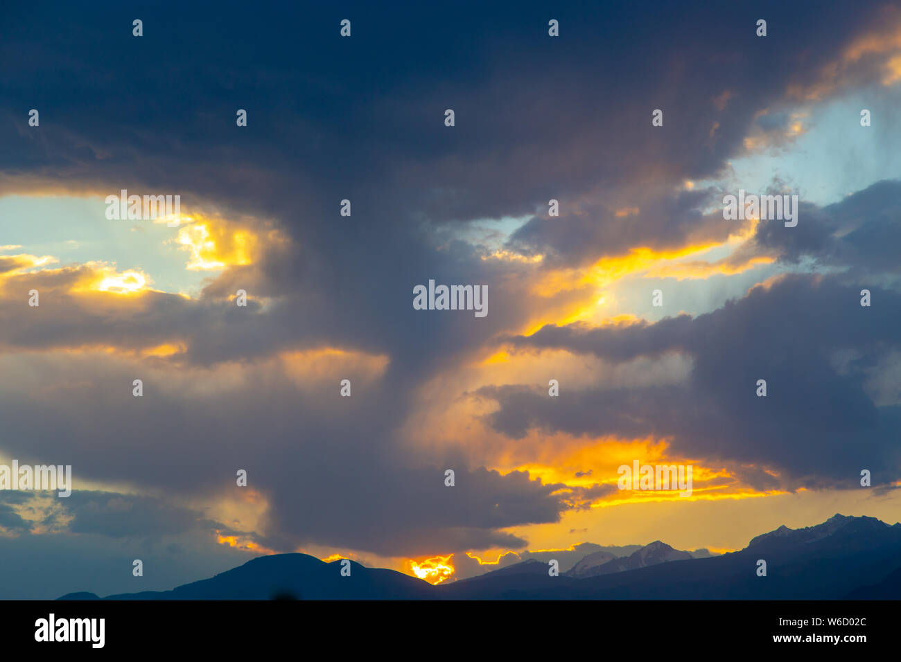 soft sunset sky. pink and gold clouds. High mountains Stock Photo - Alamy