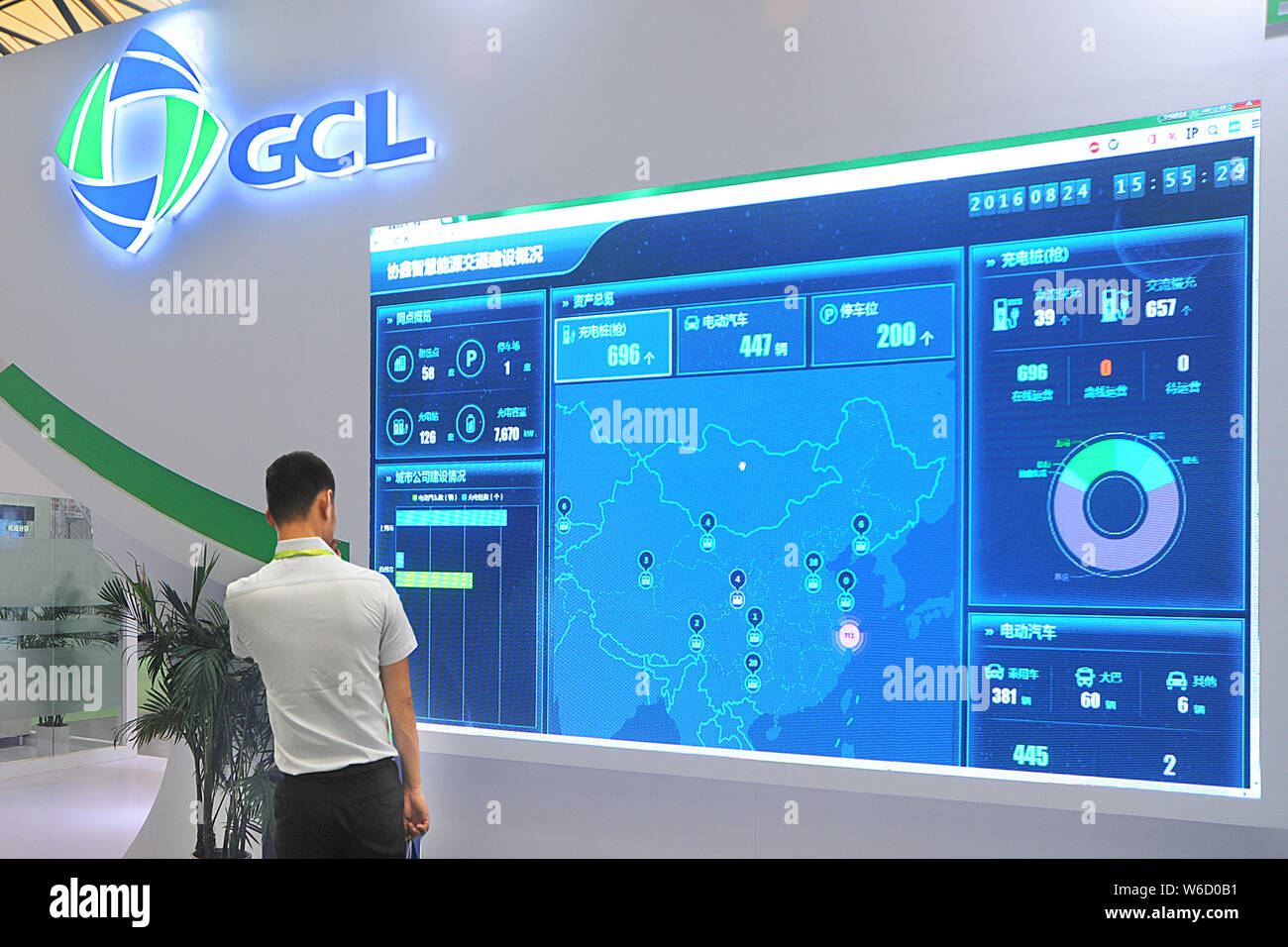 --FILE--A visitor is seen at the stand of GCL System Integration Technology Co during an exhibition in Shanghai, China, 24 August 2016.   SoftBank Gro Stock Photo