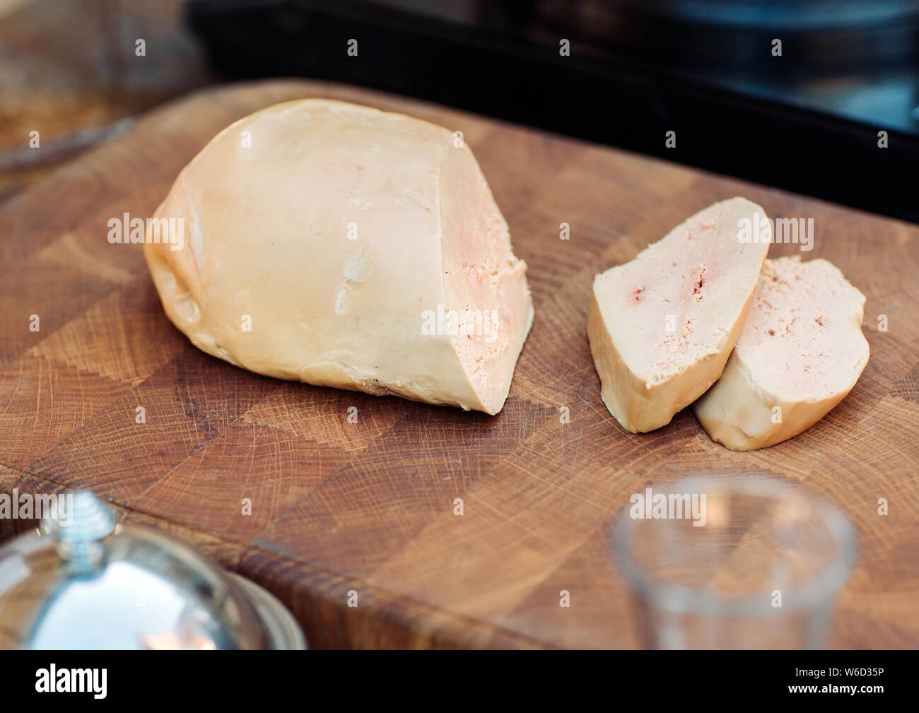 Goose liver on a wooden Board in the restaurant before cooking Stock