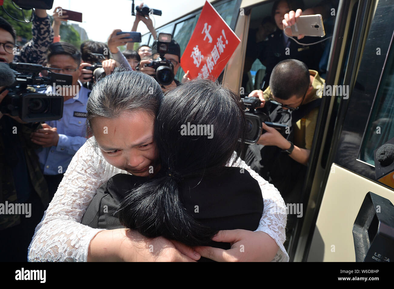 The wife of Chinese ride-sharing driver Wang Mingqing weeps as she ...