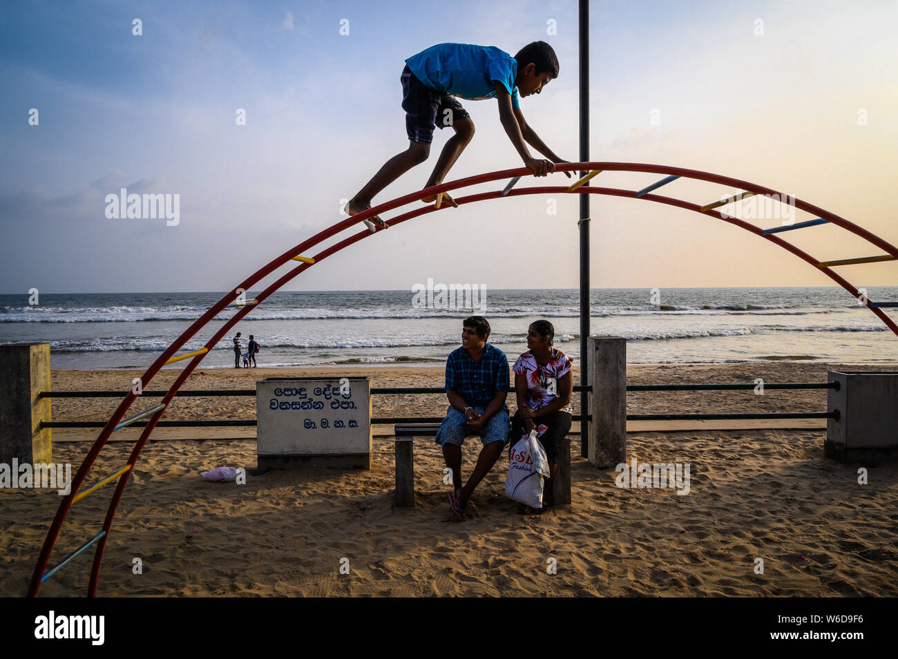 Boy in a playground by the sea, Matara, Sri Lanka. 17 January 2019 Stock Photo