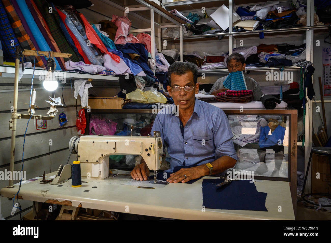 Tailors at work in their shop, Negombo, Sri Lanka Stock Photo