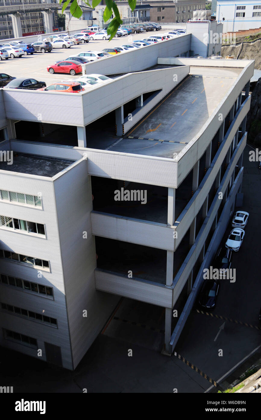 Vehicles are lined up on an 8storey rooftop parking lot in Chongqing