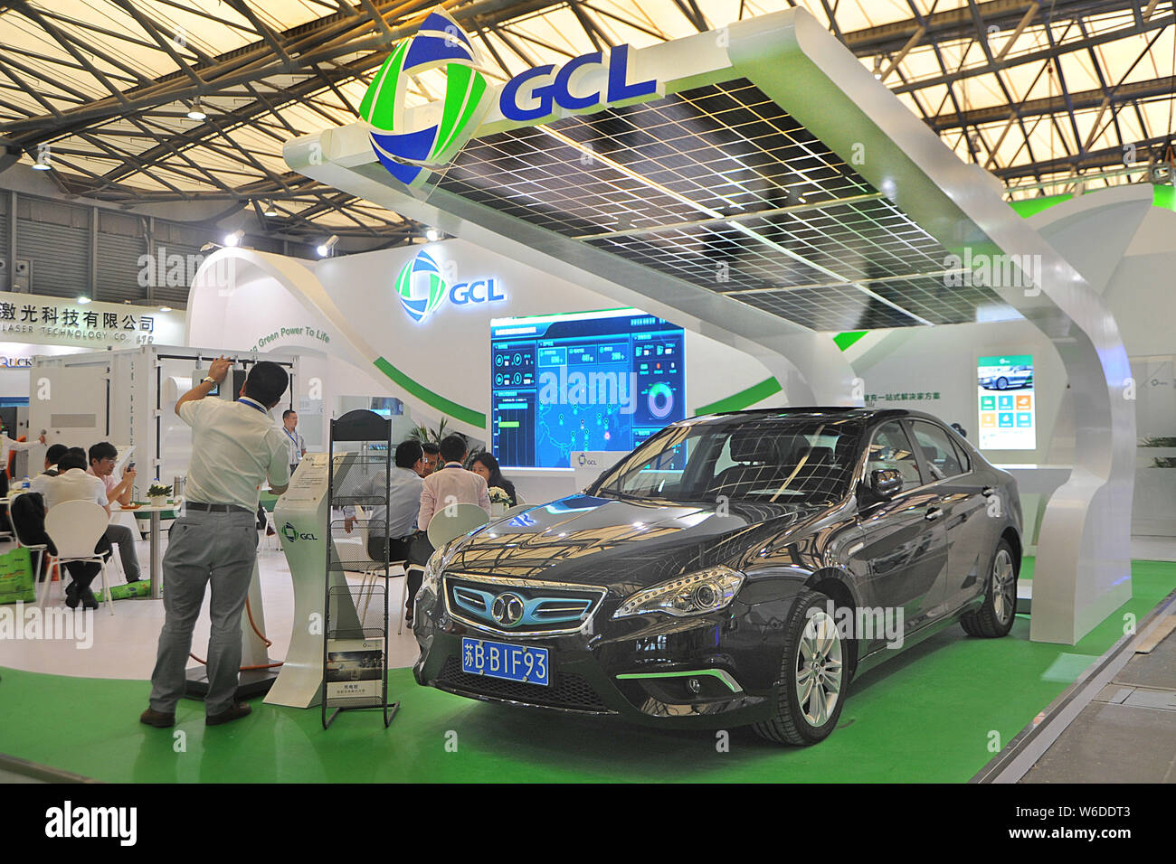 --FILE--People visit the stand of GCL System Integration Technology Co during an exhibition in Shanghai, China, 24 August 2016.   SoftBank Group Corp Stock Photo