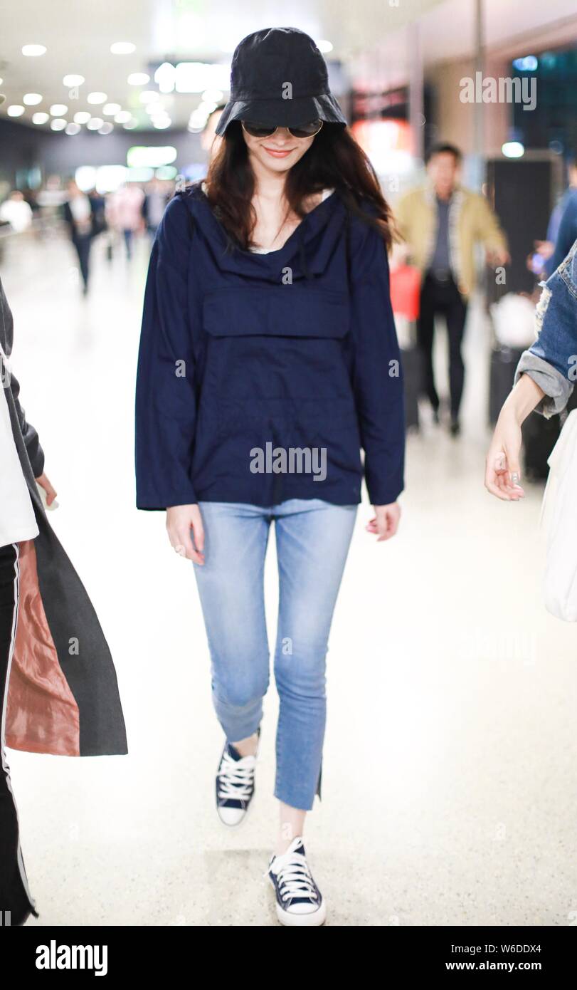 Chinese actress Ni Ni is pictured at the Shanghai Hongqiao International Airport in Shanghai, China, 11 April 2018. Stock Photo