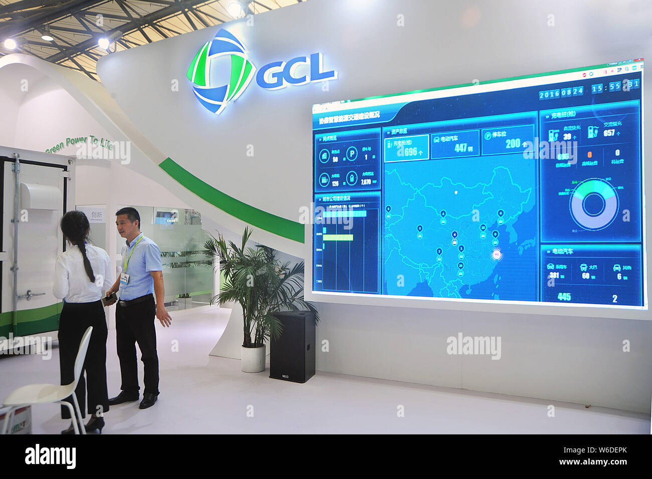 --FILE--People visit the stand of GCL System Integration Technology Co during an exhibition in Shanghai, China, 24 August 2016.   SoftBank Group Corp Stock Photo