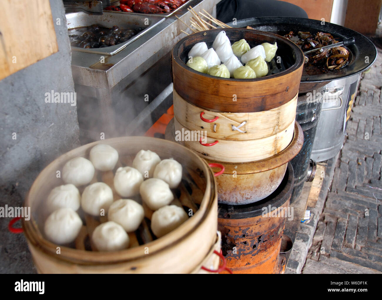 Chinese dumplings in Xitang water town near Shanghai. This is typical Chinese street food. These steamed dumplings are popular in China. Xitang, China Stock Photo