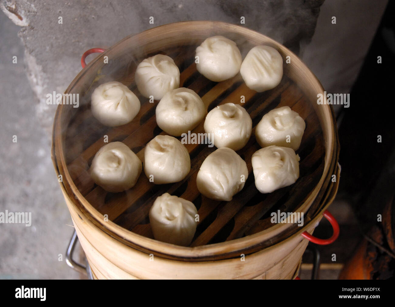 Chinese dumplings in Xitang water town near Shanghai. This is typical Chinese street food. These steamed dumplings are popular in China. Xitang, China Stock Photo