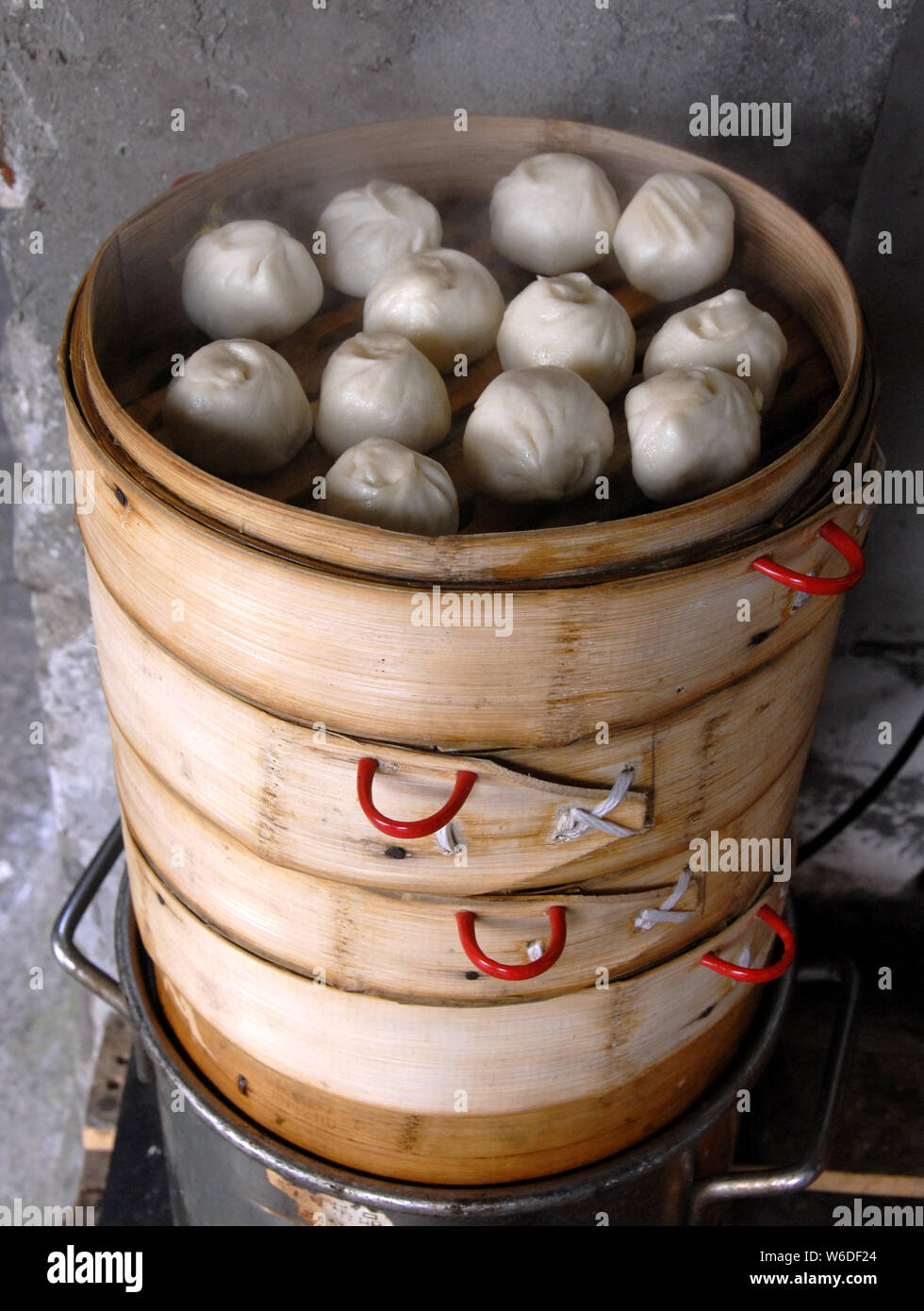 Chinese dumplings in Xitang water town near Shanghai. This is typical Chinese street food. These steamed dumplings are popular in China. Xitang, China Stock Photo