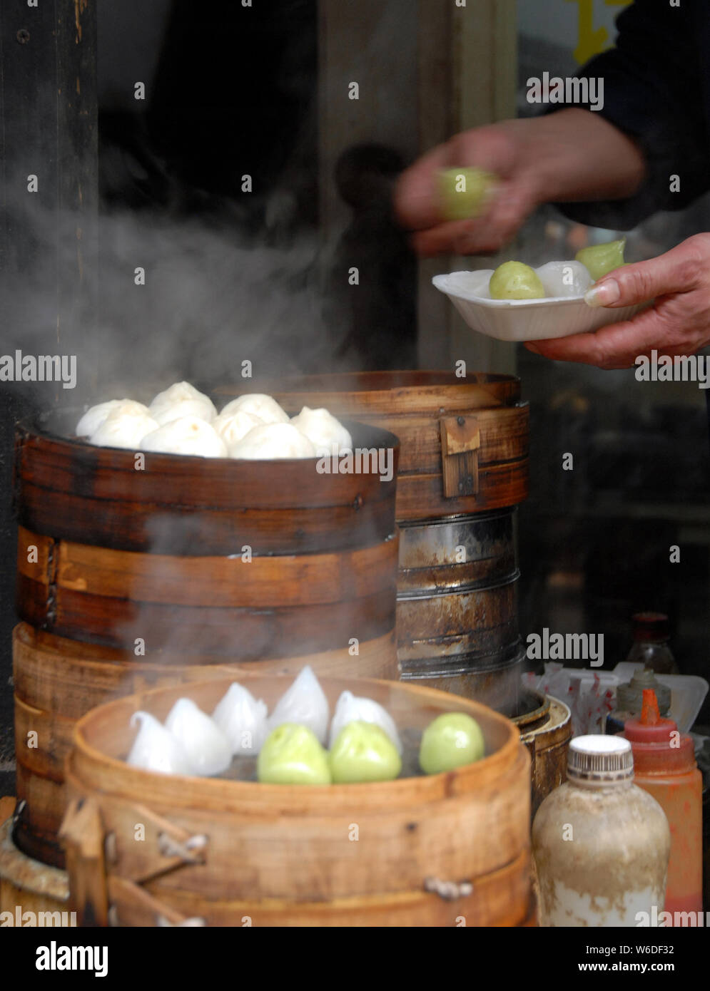 Chinese dumplings in Xitang water town near Shanghai. This is typical Chinese street food. These steamed dumplings are popular in China. Xitang, China Stock Photo