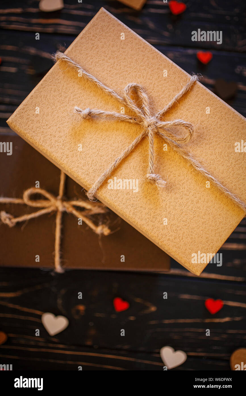 Two brown gift boxes on a wooden background Stock Photo