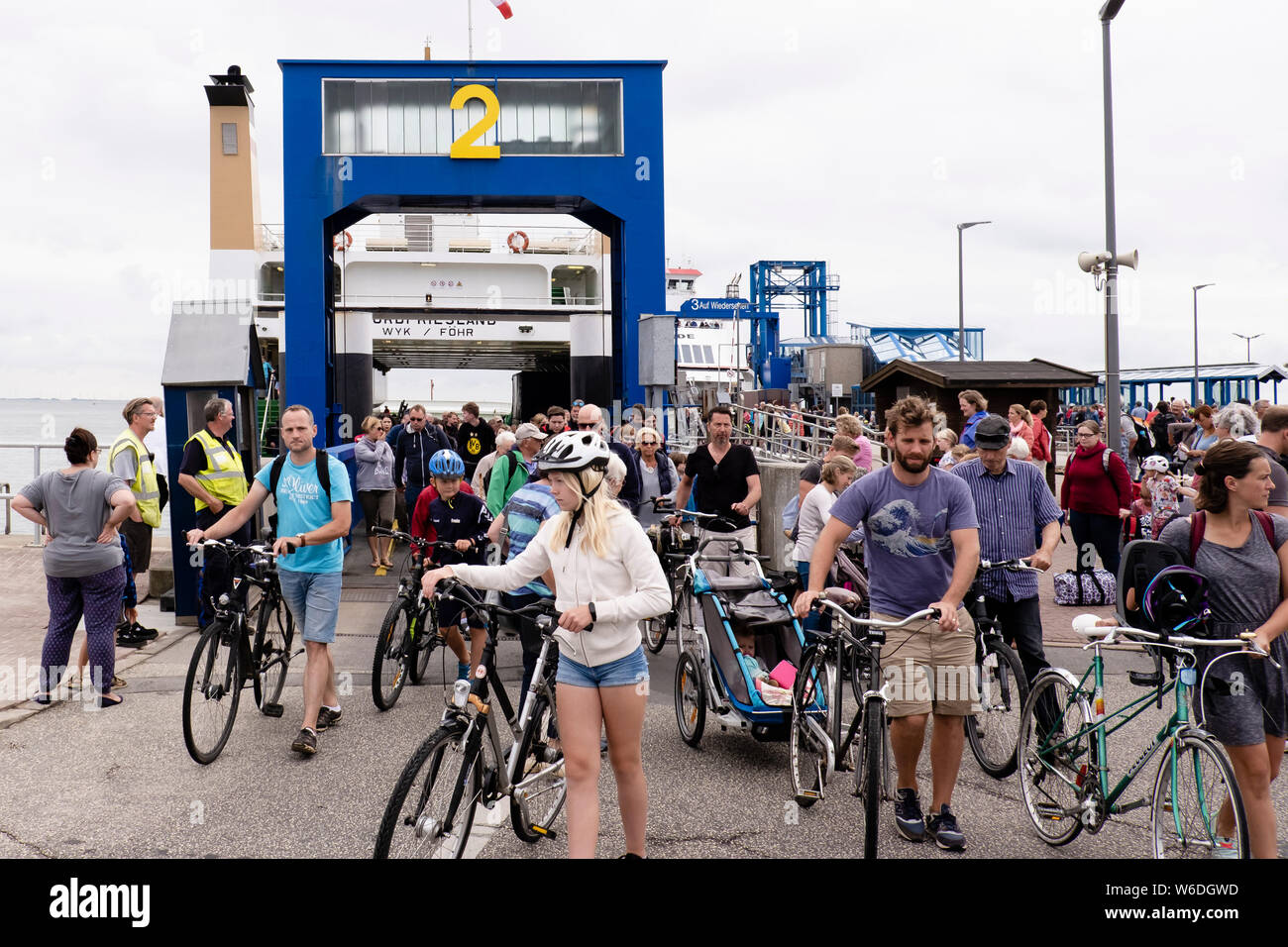 Wyk, Germany. 30th July, 2019. Passengers leave a ferry at the port of Wyk on Föhr. Around 208,000 holidaymakers visit the North Sea island every year. Credit: Frank Molter/dpa/Alamy Live News Stock Photo