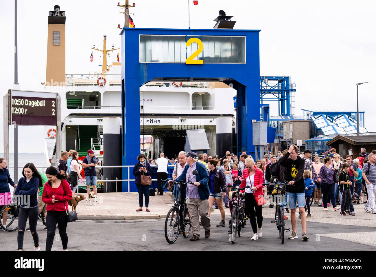 Wyk, Germany. 30th July, 2019. Passengers leave a ferry at the port of Wyk on Föhr. Around 208,000 holidaymakers visit the North Sea island every year. Credit: Frank Molter/dpa/Alamy Live News Stock Photo