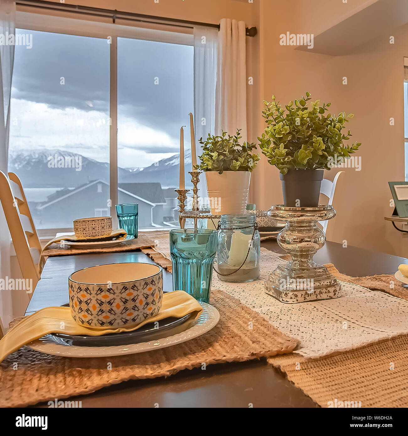 Square frame Lovely dining setting with hemp table runner and placemats on  the wooden table Stock Photo - Alamy