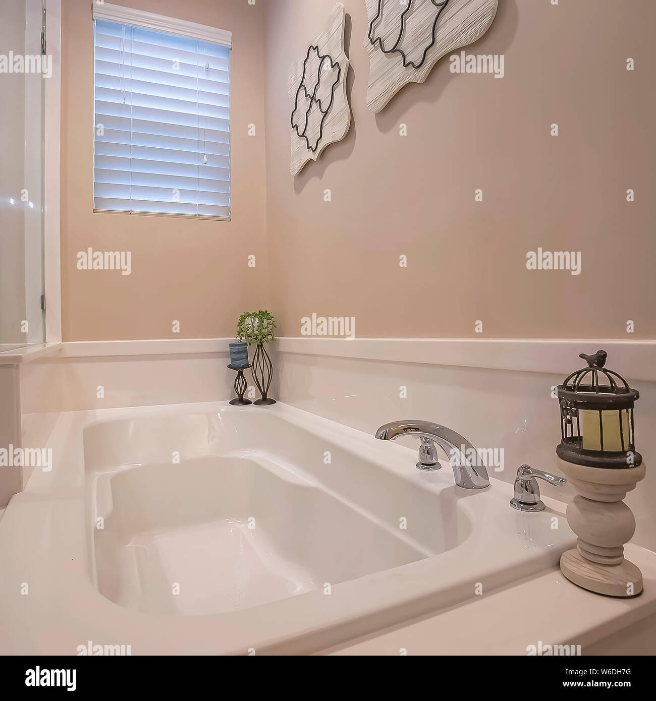 Square Built in bathtub and shower stall with glass wall inside the