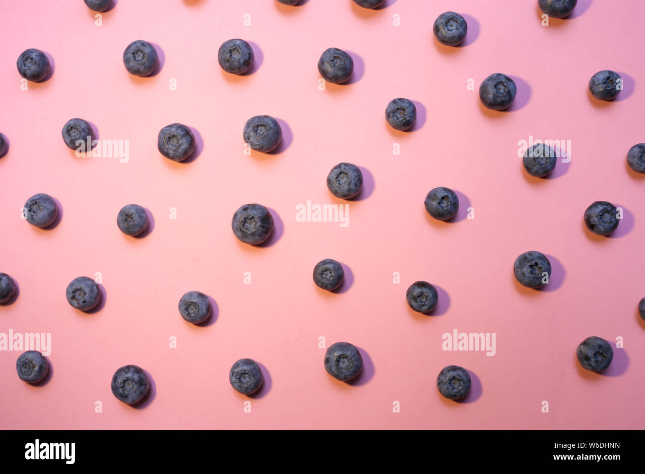 Blueberry pattern on pink background top view Stock Photo