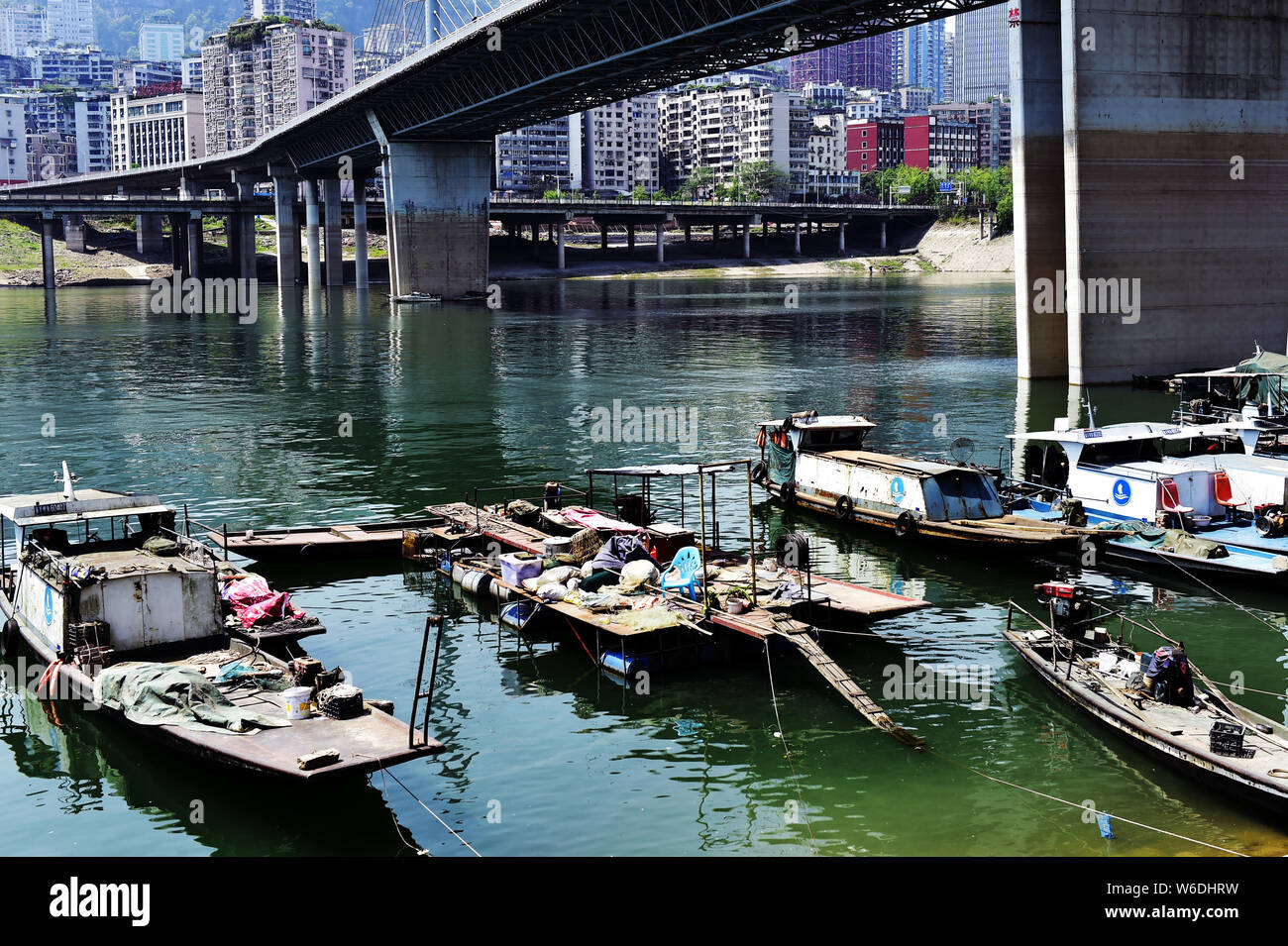 Boats are seen under a 5.6-kilometer 'overwater highway', linking downtown Wanzhou and the Wanzhou North Railway Station at the Three Gorges Reservoir Stock Photo