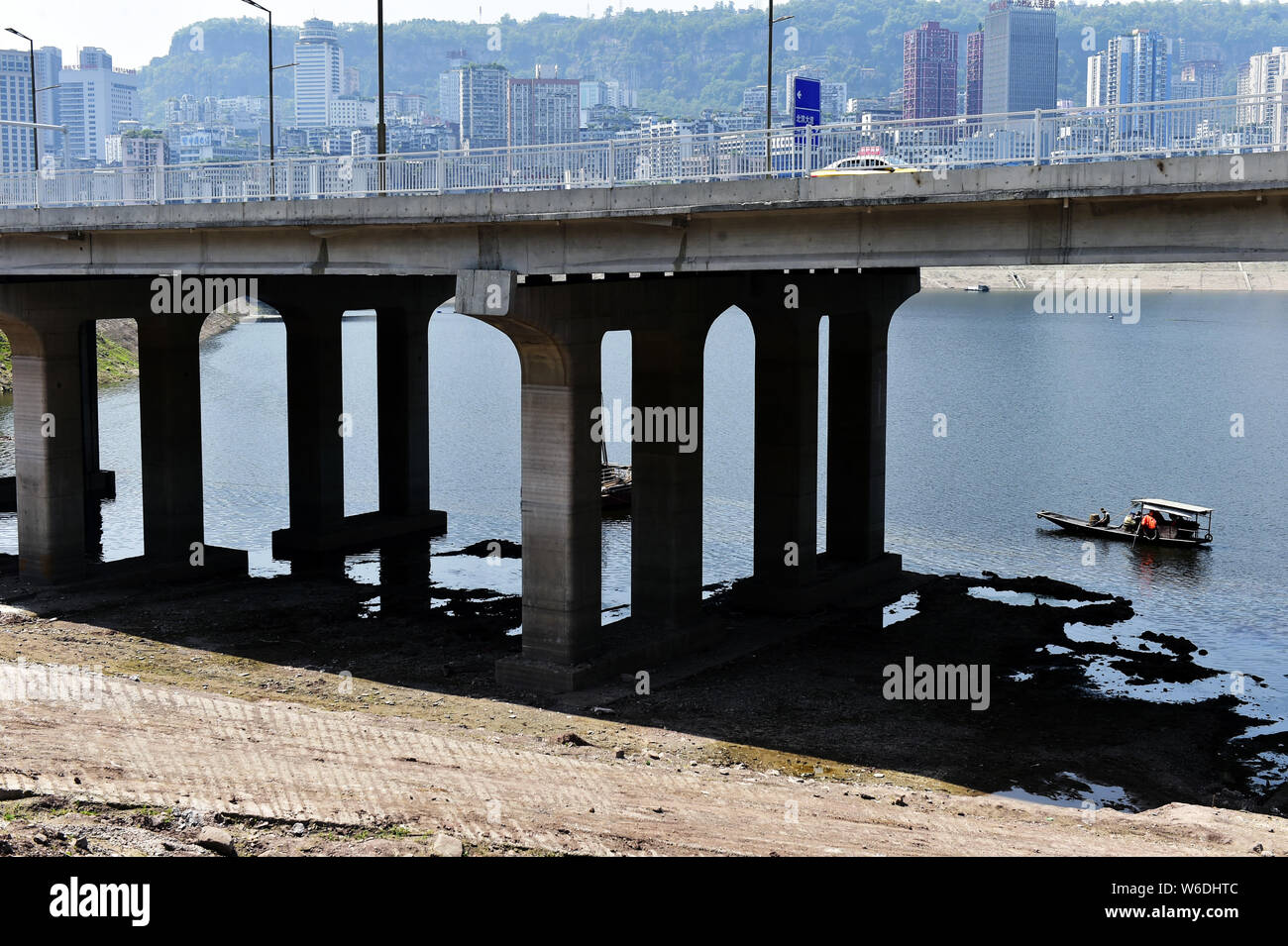 Boats are seen under a 5.6-kilometer 'overwater highway', linking downtown Wanzhou and the Wanzhou North Railway Station at the Three Gorges Reservoir Stock Photo