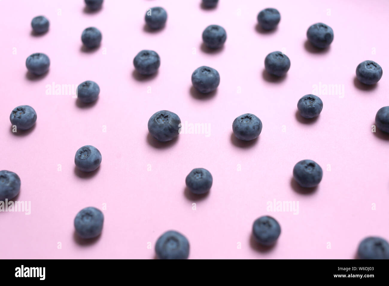 Blueberry pattern on pink background top view Stock Photo