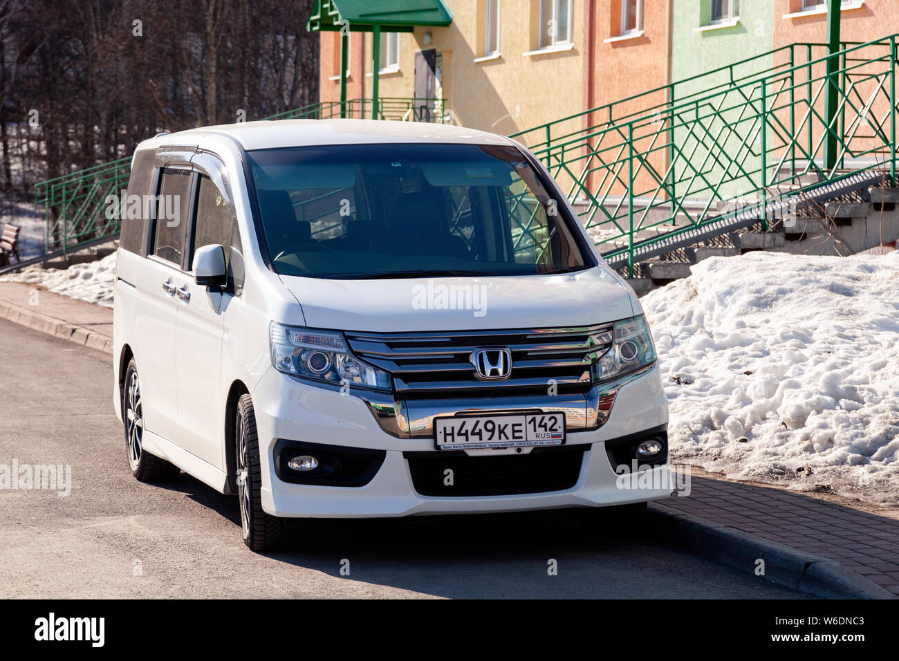 Russia Kemerovo 19 04 11 White Shining Clean Japan 4wd Minibus Car Honda Stepwgn Spada Standing On Background Of Colorful Apartment House Front Vie Stock Photo Alamy