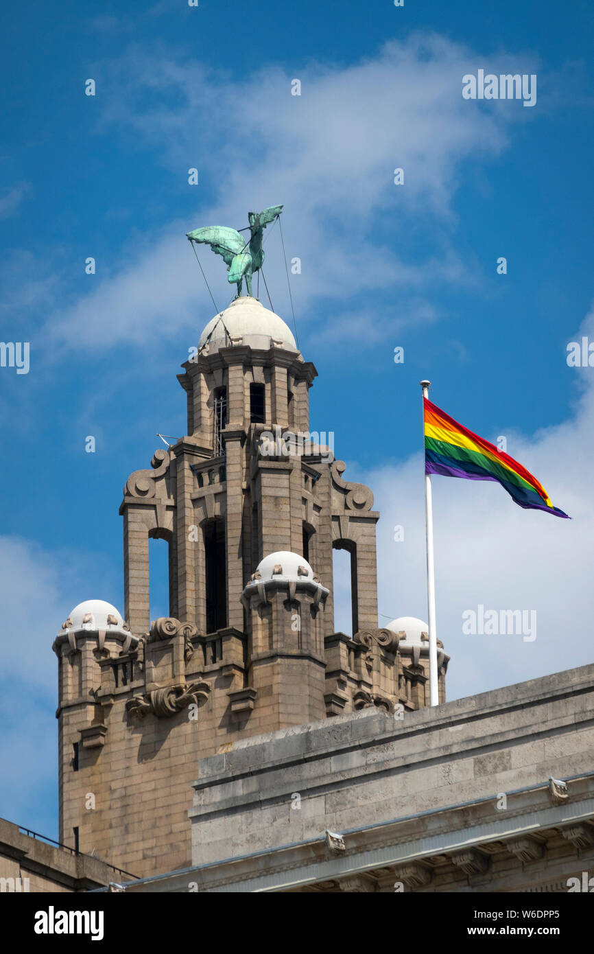 LGBT flag flying on the Liver Building in Liverpool, UK Stock Photo