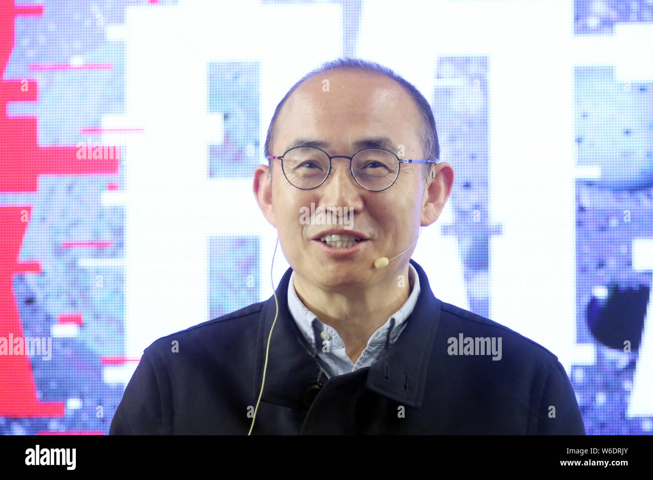 Pan Shiyi, co-founder, Chairman and co-CEO of SOHO China, shows a photo