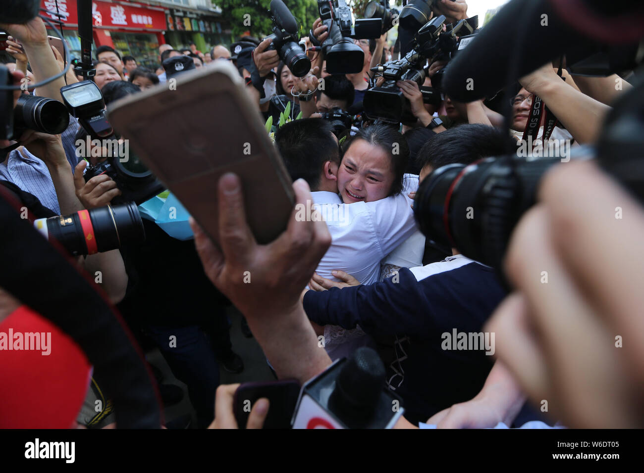 Chinese ride-sharing driver Wang Mingqing weeps as he reunites with his ...
