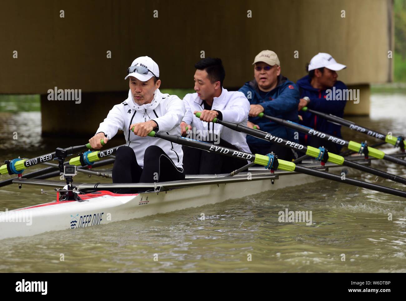 Wang Shi, front, emeritus chairman of China Vanke Co Ltd and chairman of  the Asian Rowing Federation (ARF), enjoys rowing with his teammates on the  Sl Stock Photo - Alamy