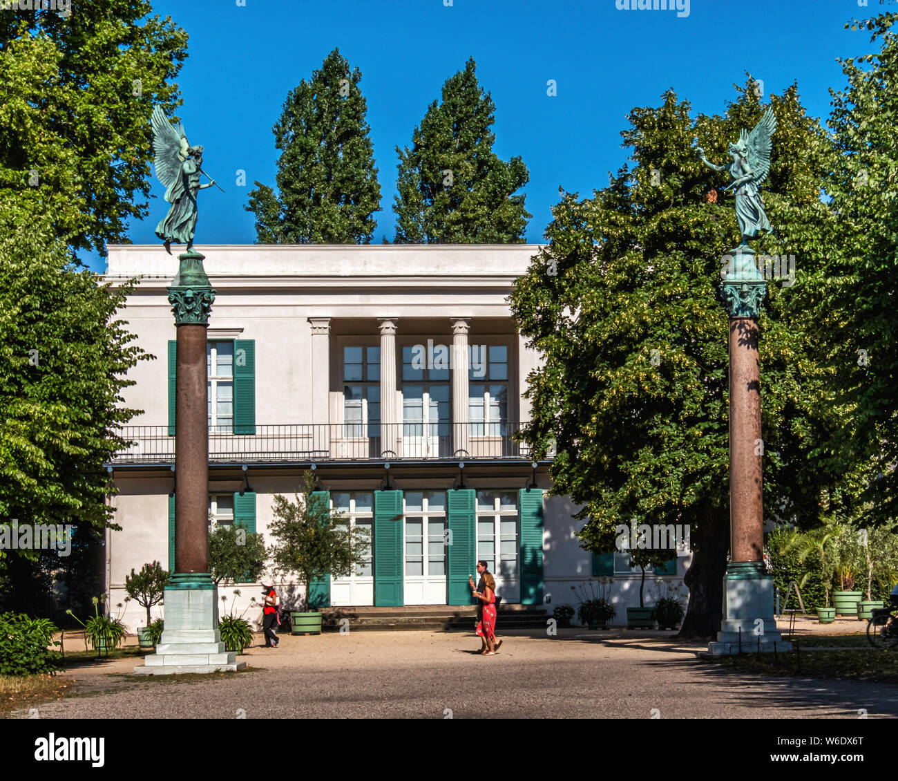 Two Angel statues on columns outside Neuer Pavillon villa in Schloss