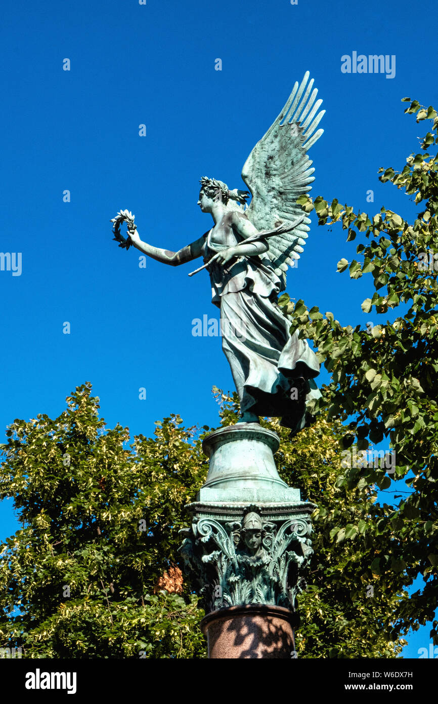 Angel statue holding laurel wreath on column in Schloss Charlottenburg