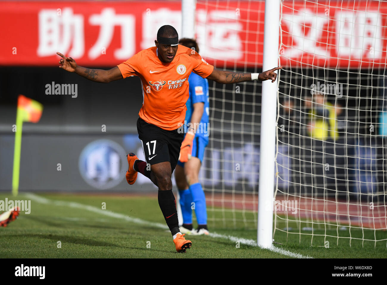 Ecuadorian football player Jaime Ayovi of Beijing Renhe celebrates after scoring a goal against Guizhou Hengfeng in their sixth round match during the Stock Photo